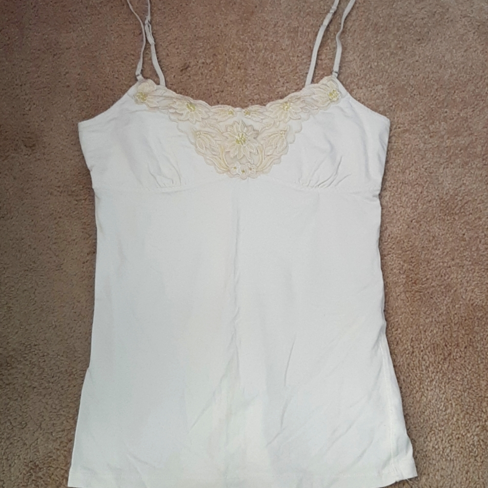 Cream tank top with floral embellishments
